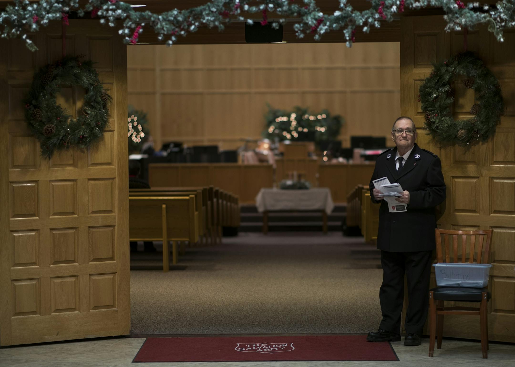 Jack Hakala a greeter waited for church members to arrive for worship services at the Salvation Army Center Sunday December 10, 2017 in Maplewood MN.