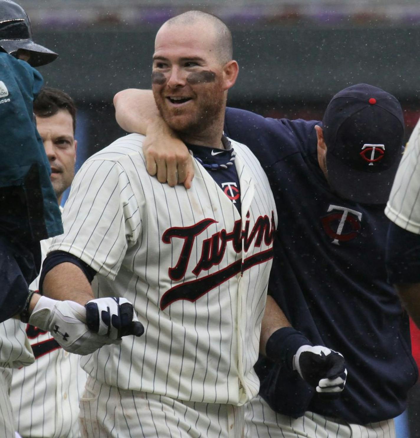 (center) Twins Ryan Doumit was mobbed after hitting a triple in 9th inning action to win the game.