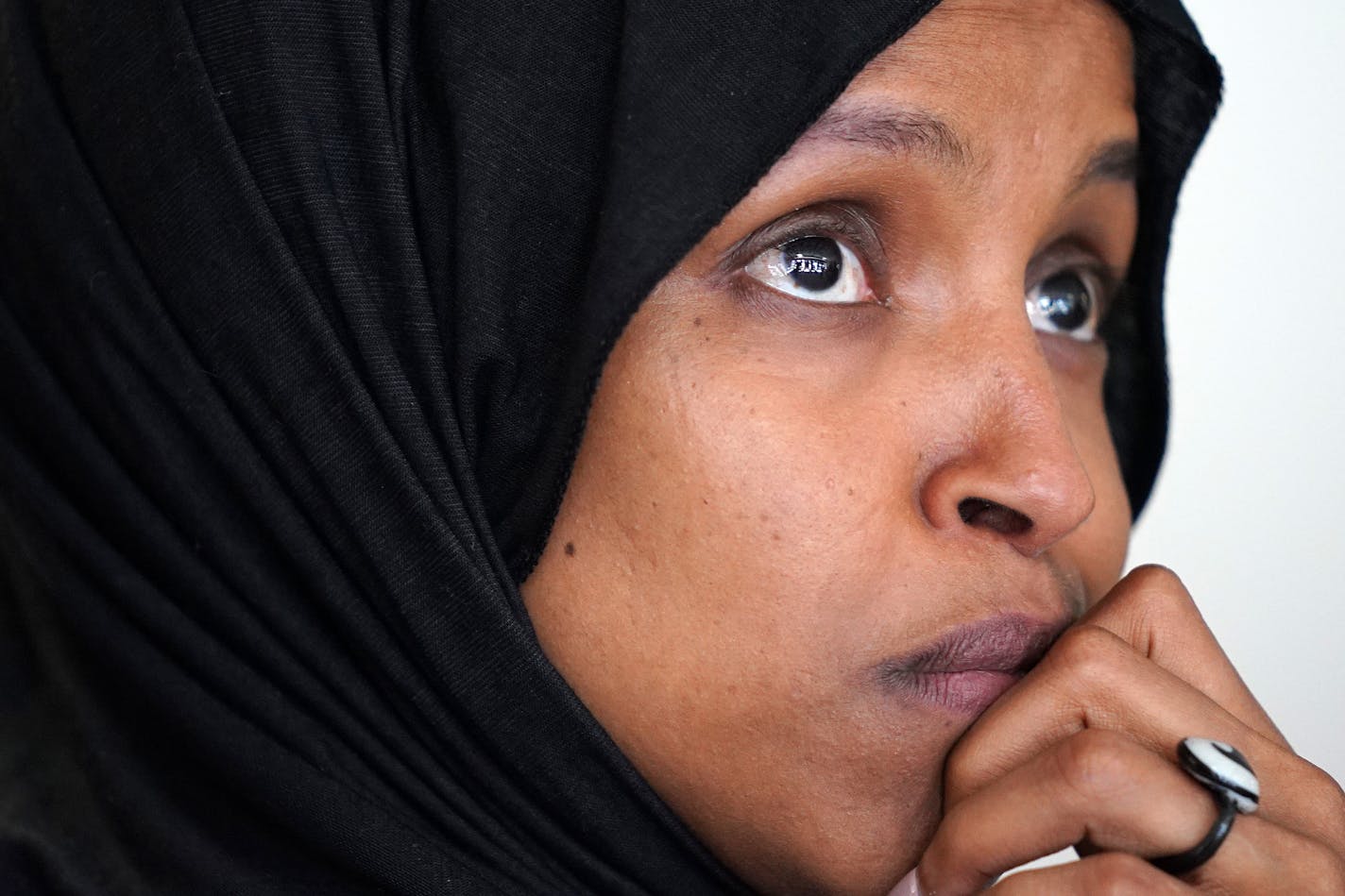 Rep. Ilhan Omar listened as nursing assistant Christina Wilson spoke during a press conference on the impacts of the DED cancellation Thursday in New Hope last week.