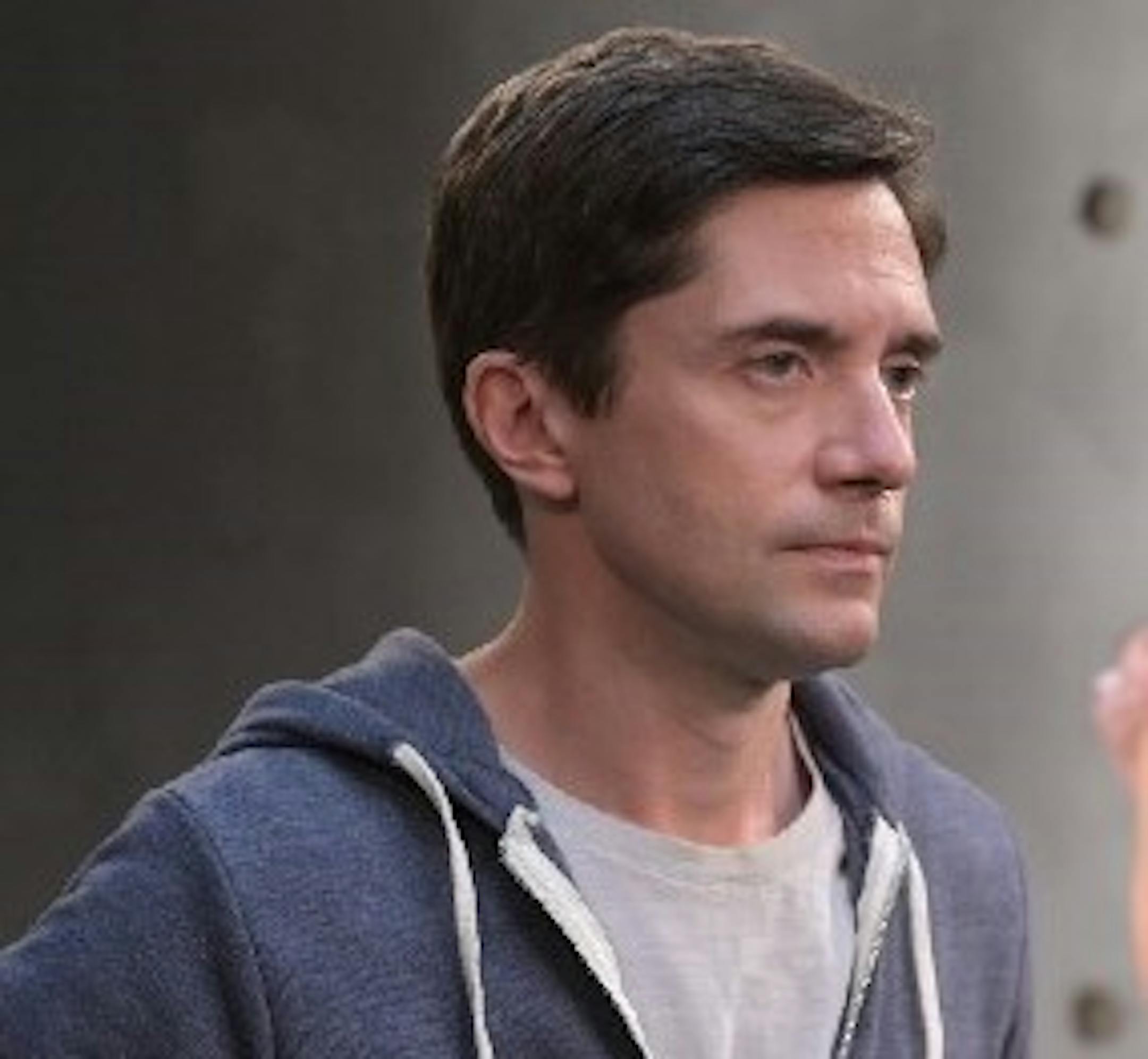 A photograph of Topher Grace in character from the TV show "Home Economics."