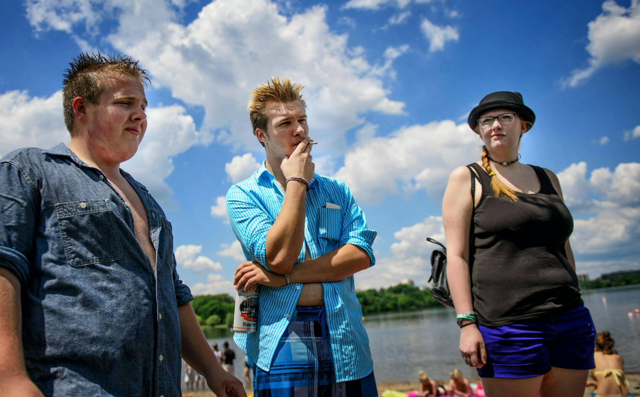 Braden Berman smoked away from the beach at Lake Calhoun Park. He was with friends Alex Hecker, left and Kat Brueske, right.