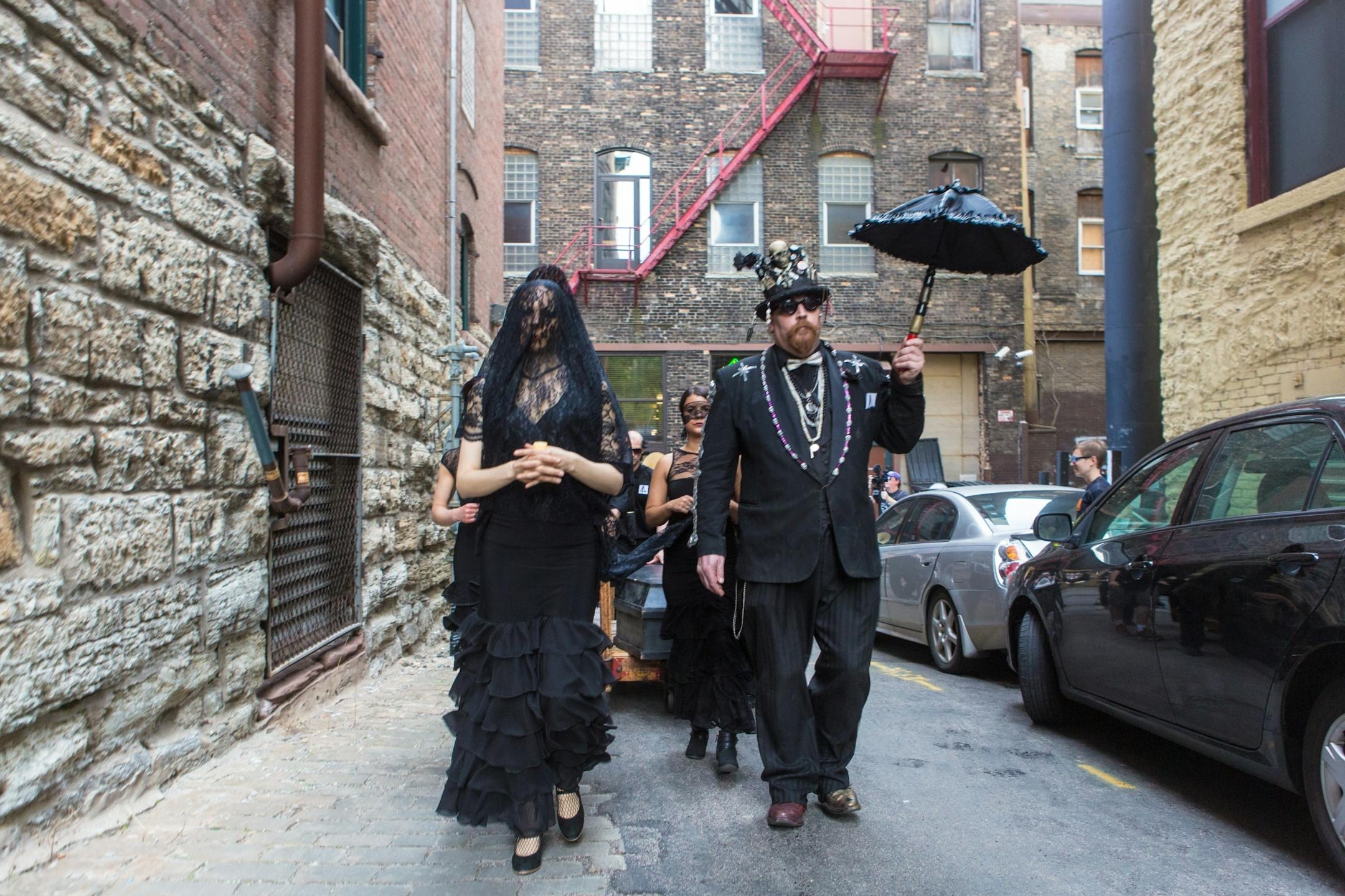 Former Jax building tenants and Lowertown arts supporters hold a wake to honor their longtime artistic quarters. Funeral began at Union Depot and then proceeded to the Jax building