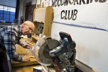 At 92, Dick Swift is the oldest member of the Glencoe club. The group has more than 40 members and operates in the basement of the old high school.