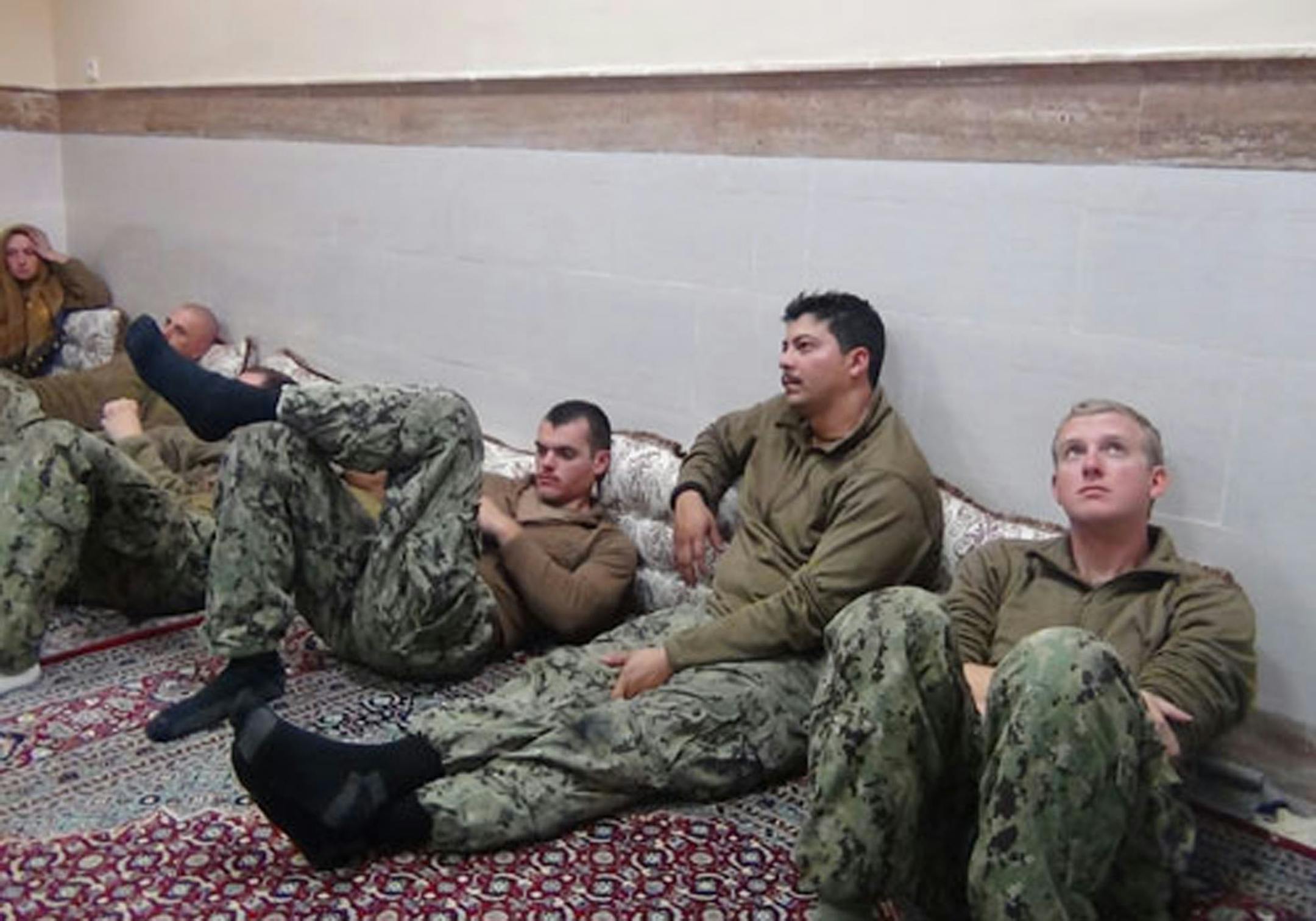 This picture released by the Iranian Revolutionary Guards on Wednesday, Jan. 13, 2016, shows detained American Navy sailors in an undisclosed location in Iran.