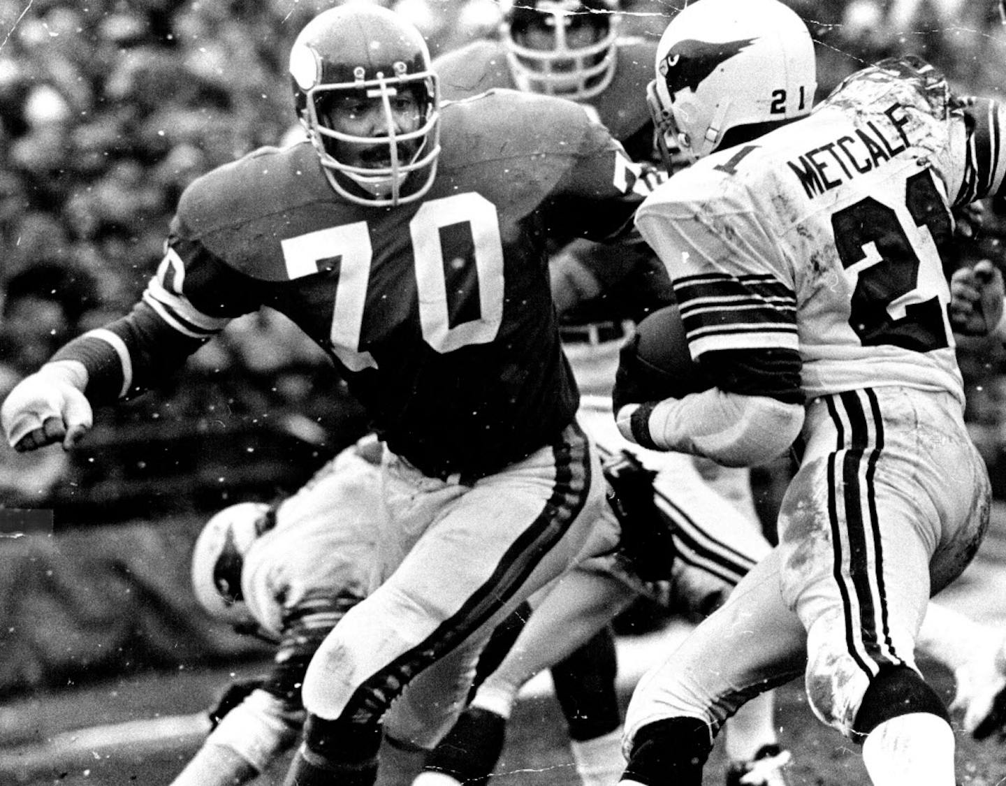 December 22, 1974 Jim Marshall (70) and Wally Hilgenberg (58) loomed in front of St. Louis's Terry Metcalf Saturday, holding him to short yardage. December 21, 1974 John Croft, Minneapolis Star Tribune