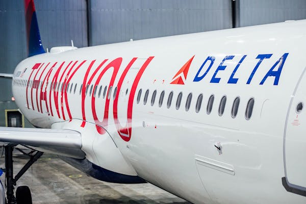 Delta painted a large "Thank you" and all of its employees' names on a plane as it distributed bonuses on Friday.