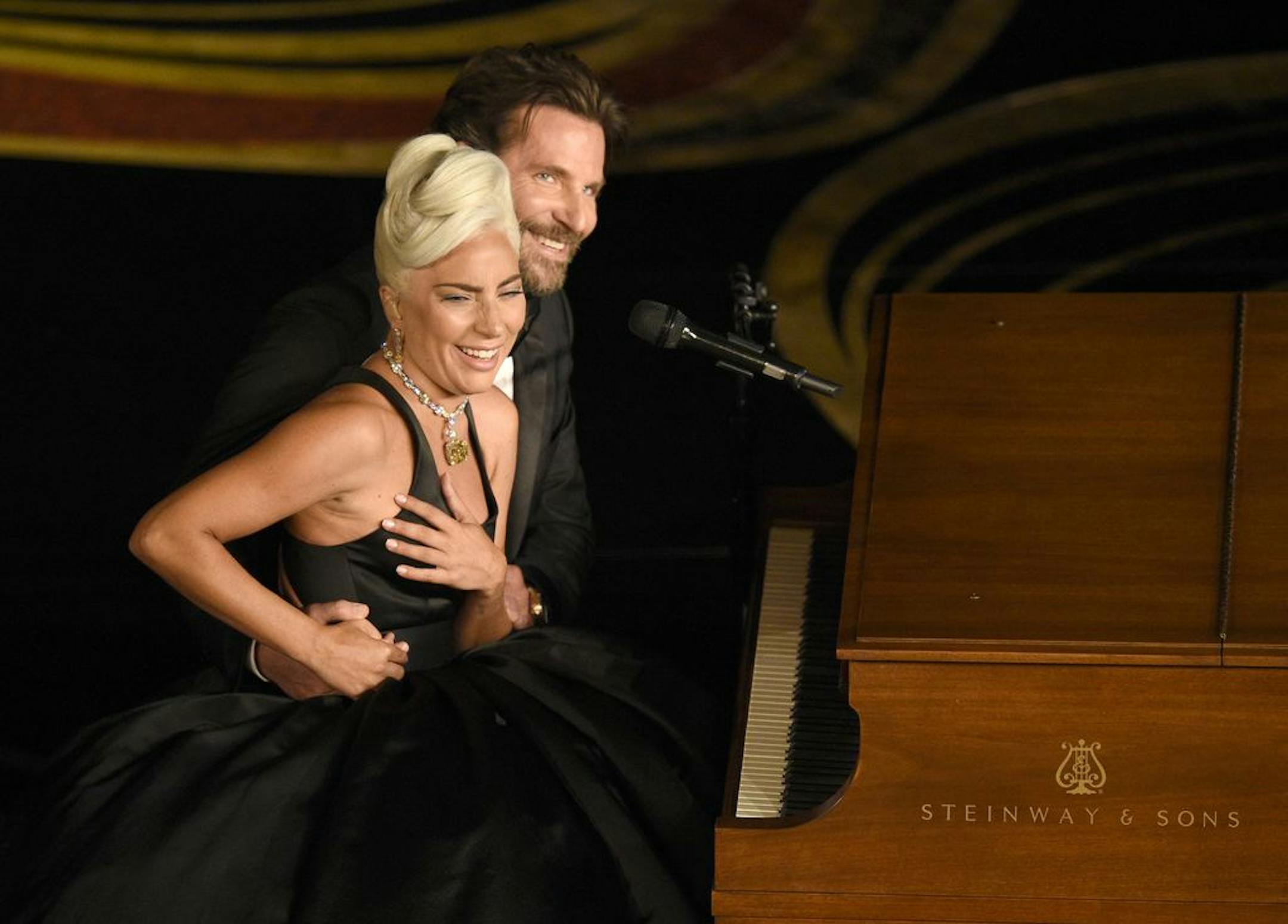 Lady Gaga, left, and Bradley Cooper react to the audience after a performance of "Shallow" from "A Star is Born" at the Oscars on Sunday, Feb. 24, 2019, at the Dolby Theatre in Los Angeles.