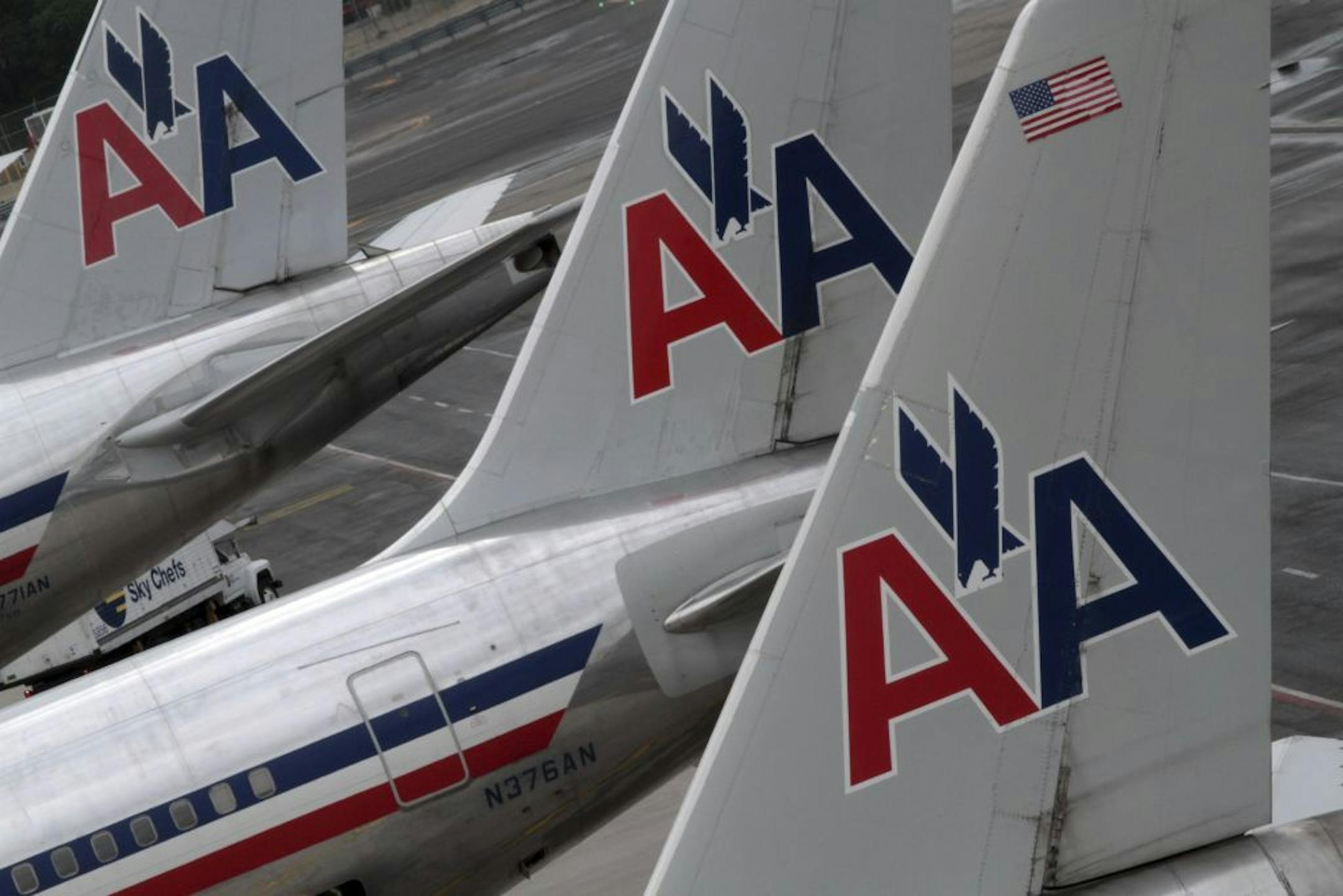 In this Wednesday, Aug. 1 2012 photo, American Airlines airplanes are at parked at the gate at JFK International airport in New York.