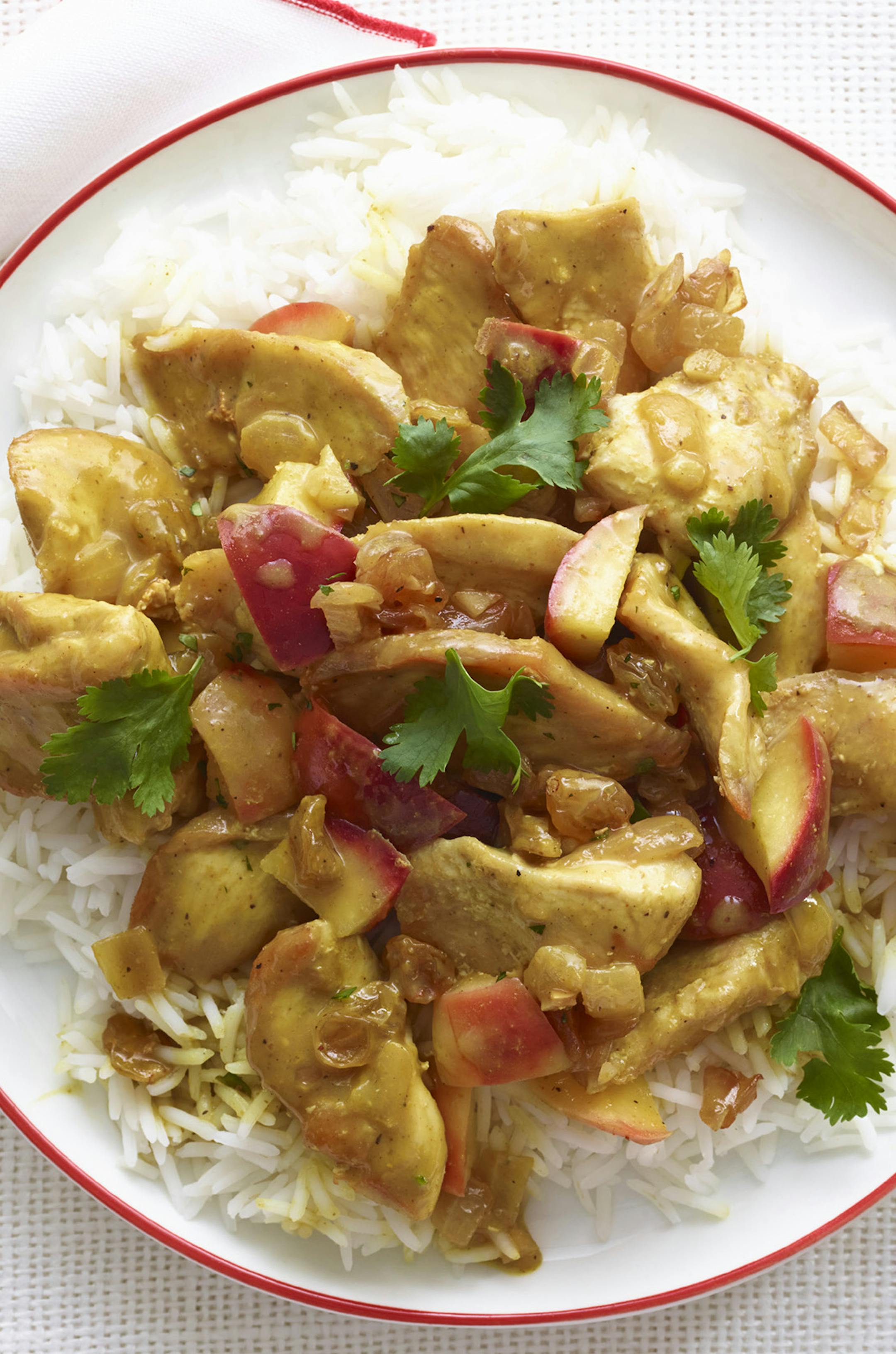 Coconut chicken curry. The credit line should read: Reprinted with permission from Woman‚Äôs Day Easy Everyday Lighter Dinners, October 2014, Hearst Books.