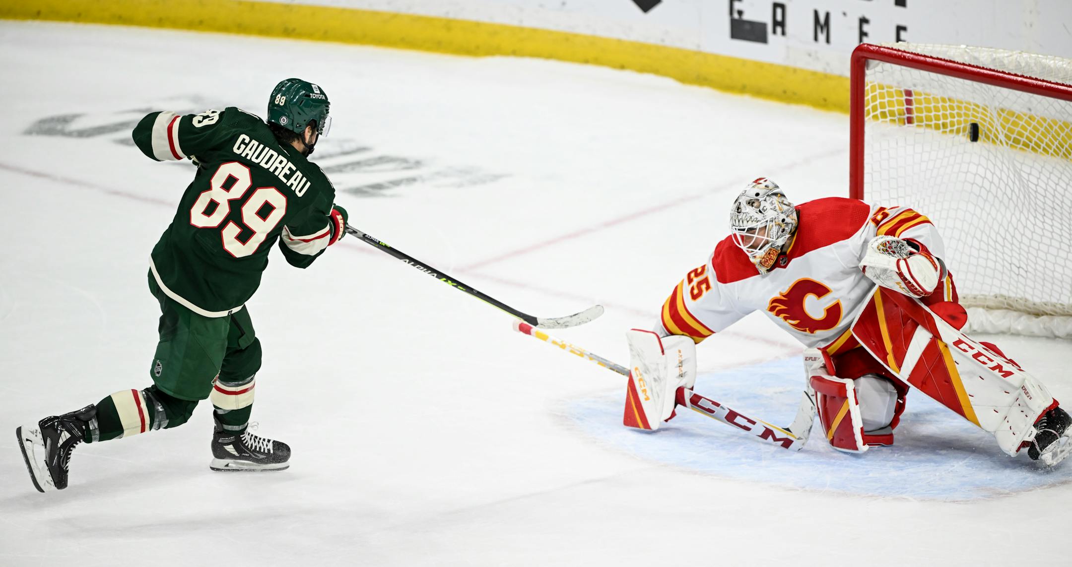 Minnesota Wild center Frederick Gaudreau (89) scores a shootout goal against Calgary Flames goaltender Jacob Markstrom (25), giving the Wild a short-lived lead.