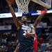 Minnesota Timberwolves guard Jimmy Butler (23) goes to the basket in front of New Orleans Pelicans center DeMarcus Cousins during the first half of an