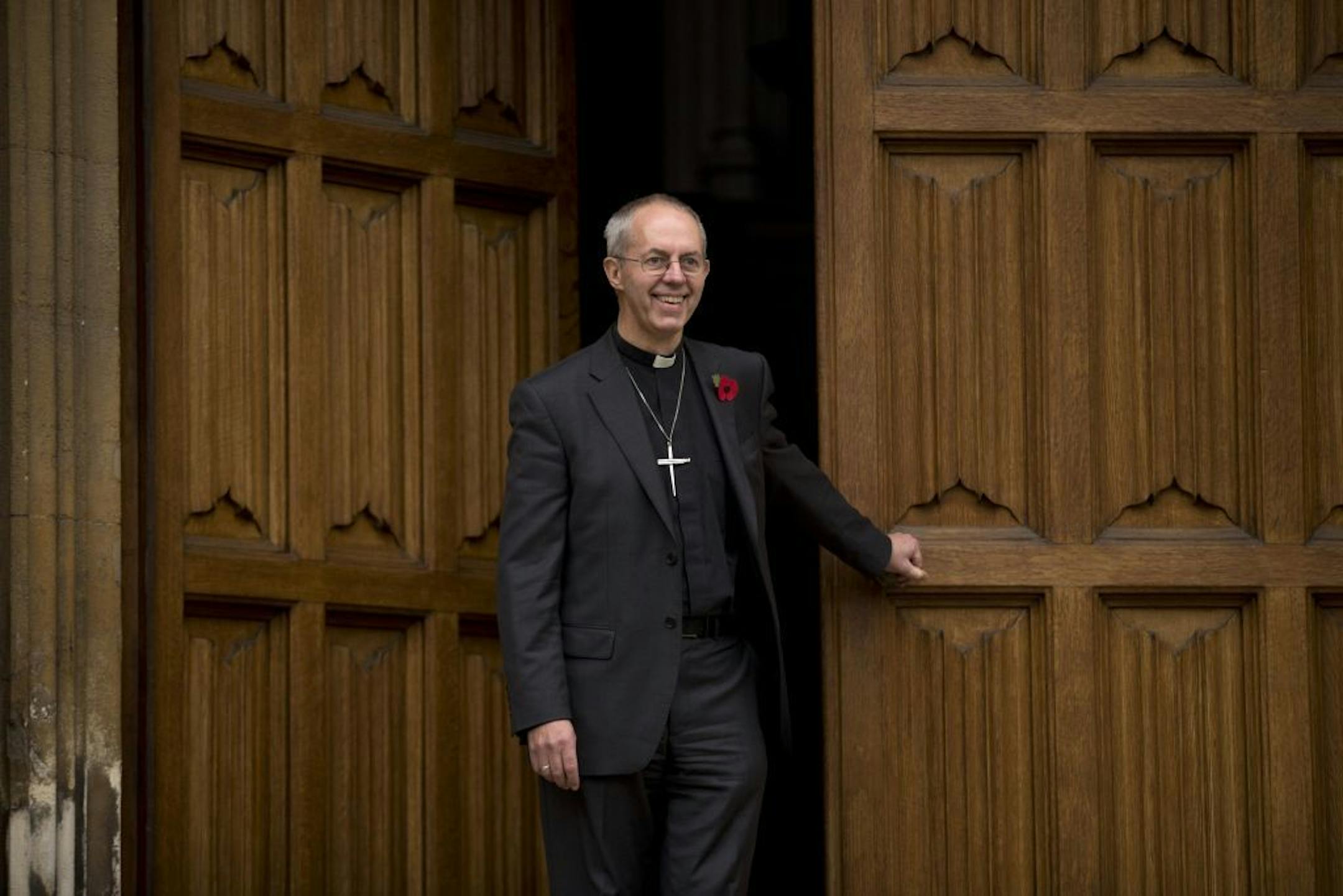 Britain's bishop of Durham Justin Welby poses for photographers after a news conference following the announcement he will become the next archbishop of Canterbury at Lambeth Palace in London, Friday, Nov. 9, 2012. The former oil executive with experience in conflict resolution has been chosen to lead a global Anglican Communion riven by sharply divided views on gay people and their place in the church. Britain's Prime Minister David Cameron announced Friday that Justin Welby, 56, a fast-rising