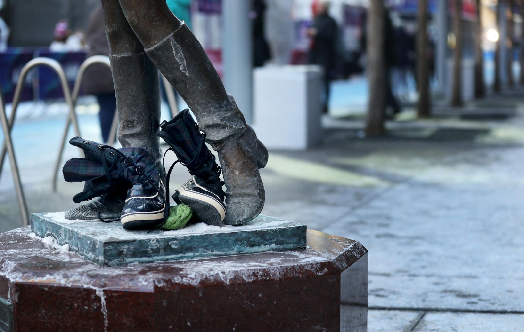 Perhaps as a joke or a warning to visiting fans for the Super Bowl, someone placed a pair of winter boots at the base of the Mary Tyler Moore statue on Nicollet Mall Thursday, Feb. 1, 2018, in downtown Minneapolis, MN.