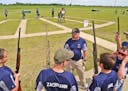 Pep talk: A coach of the Howard Lake-Waverly-Winstead trapshooting team gave final instructions before his squad shot trap at last summer's championsh