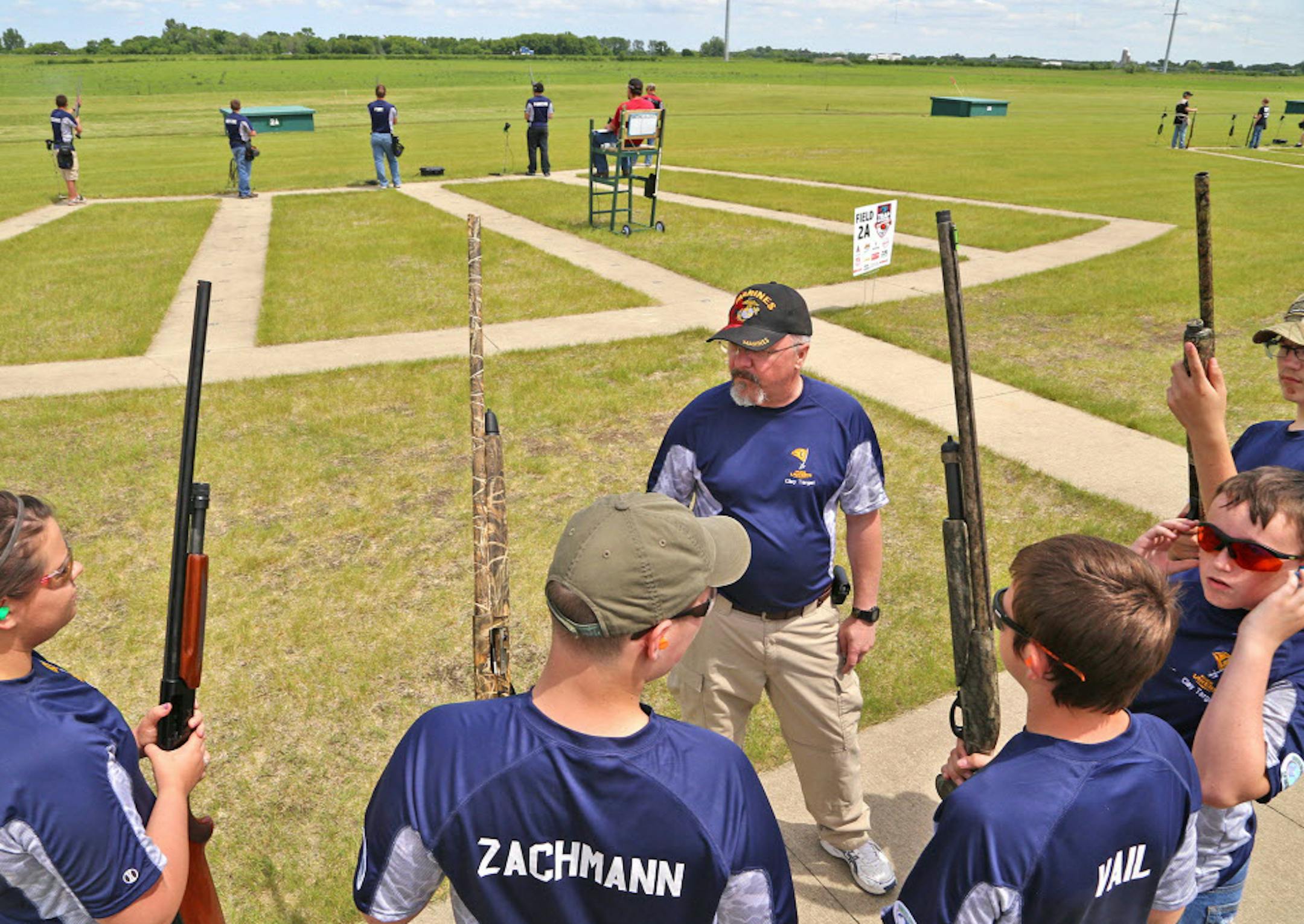 Pep talk: A coach of the Howard Lake-Waverly-Winstead trapshooting team gave final instructions before his squad shot trap at last summer's championship in Alexandria.This year's prep trapshooting championship at the same location might be the largest trapshoot of any kind ever held, worldwide. ORG XMIT: MIN1506121131270976