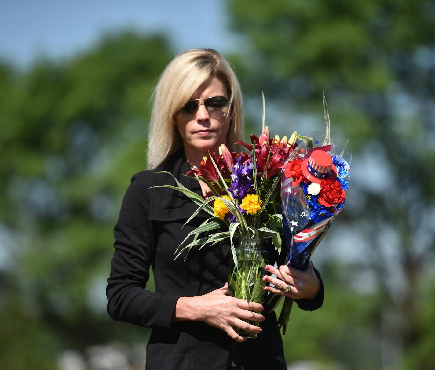 Mary Wise of the Wise Family Funeral Home held flowers as the man we put to rest. ] MARK VANCLEAVE &#xef; mark.vancleave@startribune.com * Three years after his body was found in a shed near Rosemount, an unidentified man was buried in a small funeral Friday, June 30, 2017 in Inver Grove Heights. The Hennepin County Medical Examiner's office has spent three years trying to identify the remains.