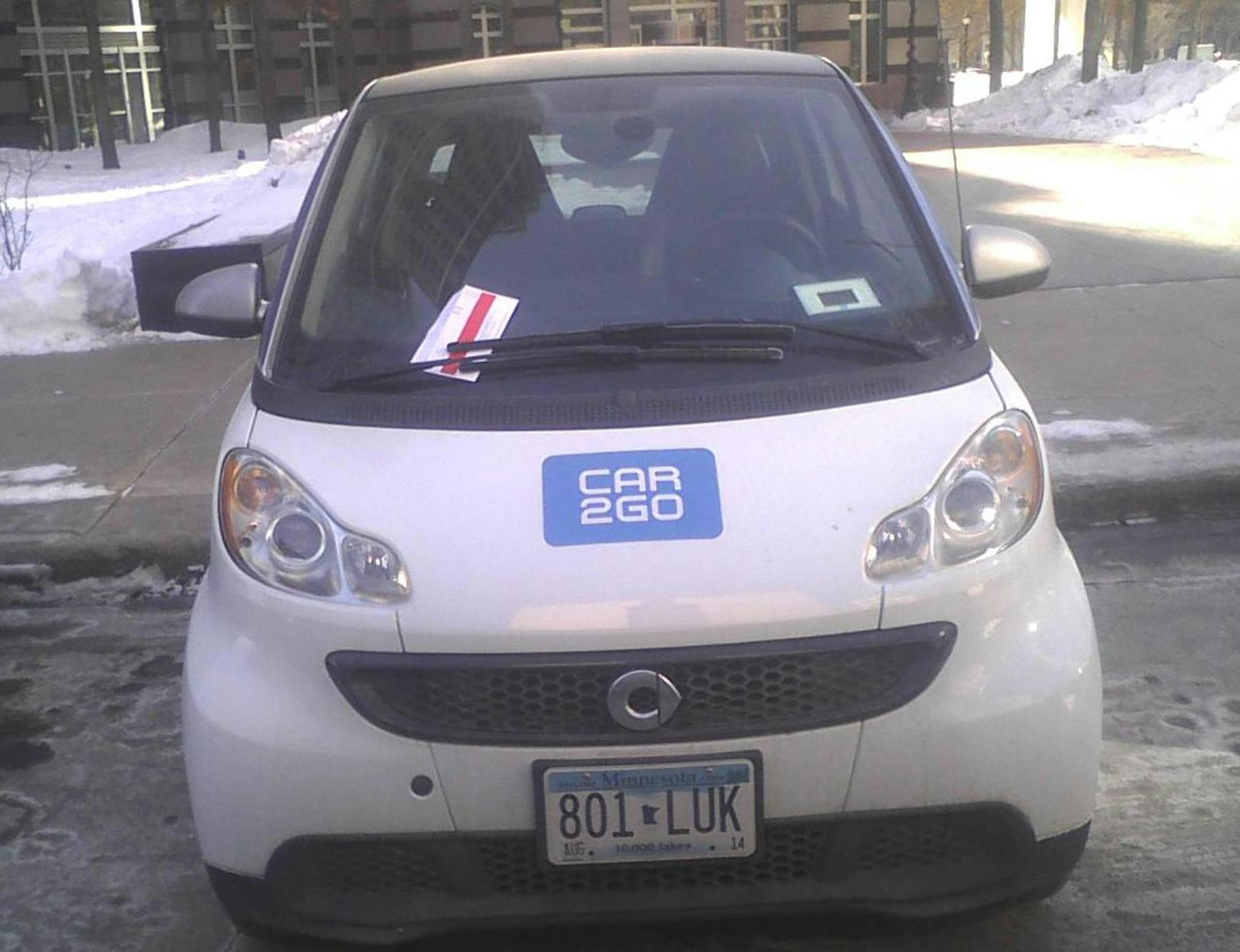 A driver backed this tiny Smart Fortwo Passion perpendicular in an open space between two legally parked vehicles and left the front wheels facing S. 7th Street across from the Hennepin County Government Center in Minneapolis.