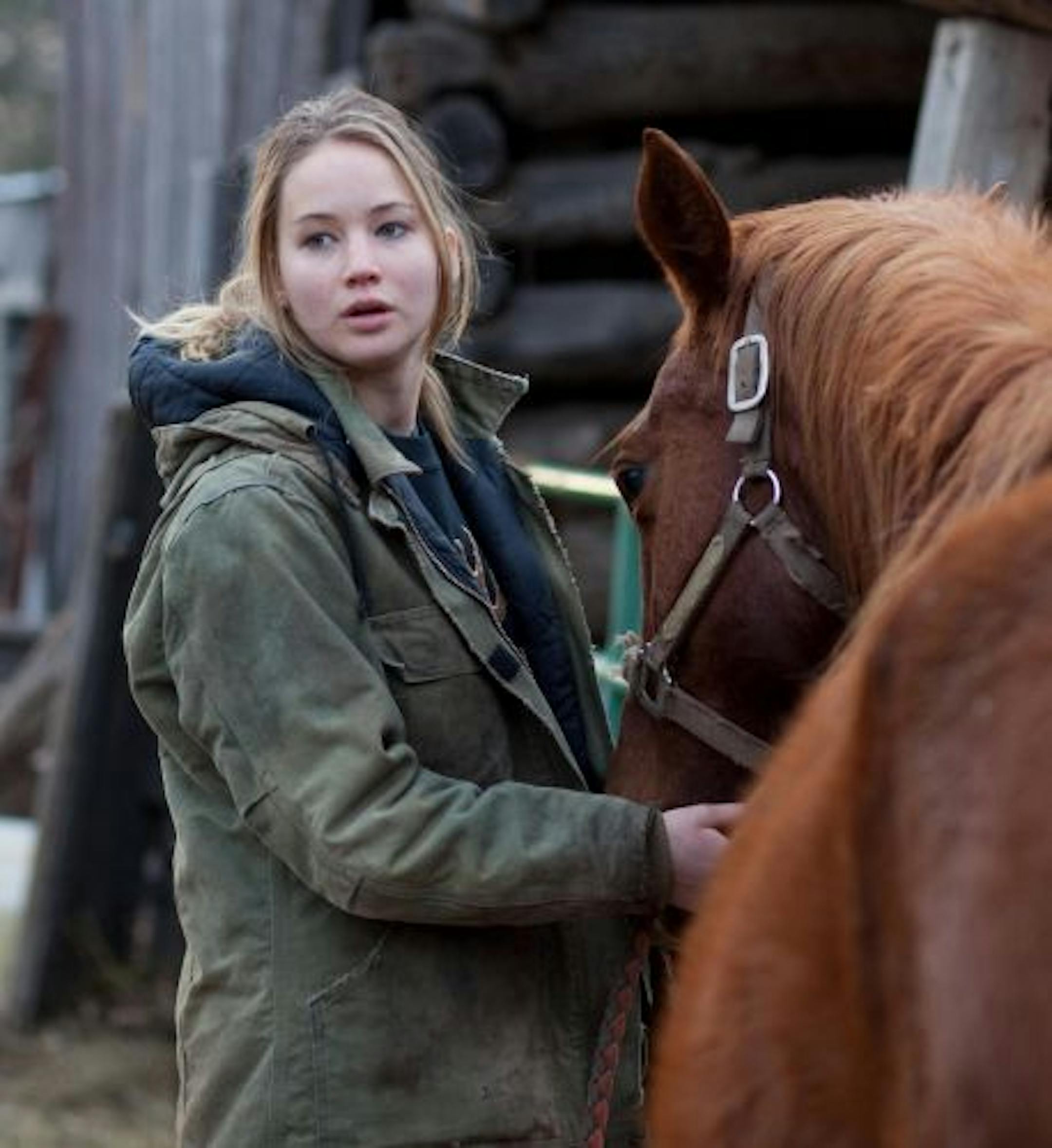 In this film publicity image released by Lionsgate, Jennifer Lawrence is shown in a scene from "Winter's Bone."