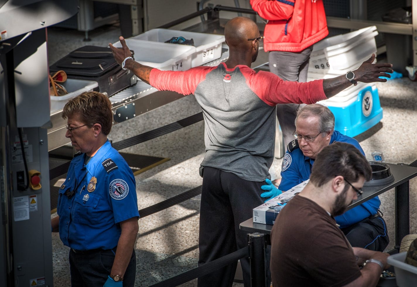 A passenger was stopped for a pat-down as he went through security at the Minneapolis-St. Paul International Airport last week.