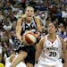 San Antonio Silver Stars guard Becky Hammon, left, drives to the basket past Sacramento Monarchs guard Kara Lawson during the second quarter of a WNBA