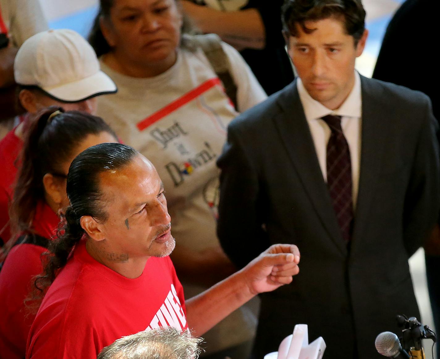 James Cross, the founder of the street outreach group Natives Against Heroin, spent nearly half of his life in prison for drug-related crimes but is working hard now to help people in his Native American community, particularly the poor and those with substance abuse problems. Here, Cross spoke at a homeless encampment meeting as Minneapolis Mayor Jacob Frey listened at the Minneapolis American Indian Center Wednesday, Aug. 22, 2018 in south Minneapolis, MN.] DAVID JOLES &#xef; david.joles@start