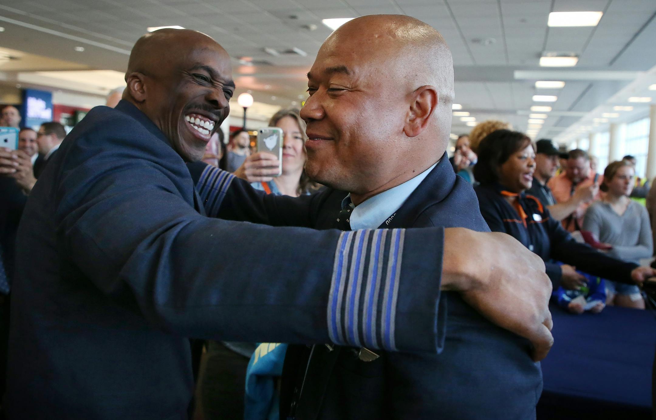 JetBlue pilots Capt. Eric Scott left welcomed Capt. Eric Poole to Minneapolis as JetBlue begins service at MSP Thursday May 3, 2018 Bloomington, MN.