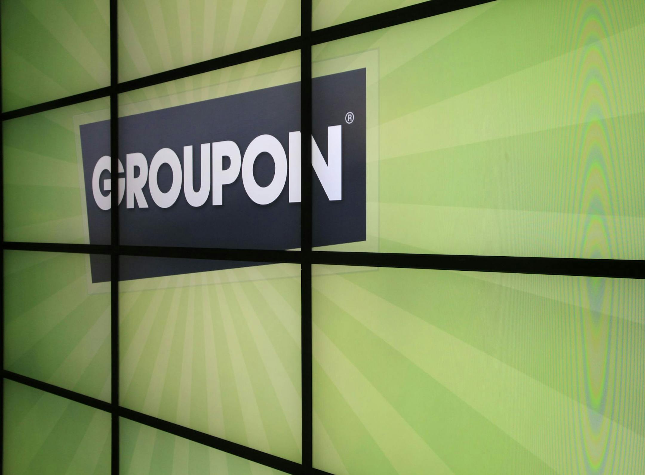 he Groupon logo inside the online coupon company's offices Thursday, Sept. 22, 2011, in Chicago. Online coupon seller Groupon Inc. is discounting its expectations for its first stock offering, reported Friday, Oct. 21, 2011. The company, which offers consumers daily discounts targeted to their city and preferences, now expects net proceeds of about $478.8 million from its initial public offering of 30 million shares. (AP Photo/Charles Rex Arbogast) ORG XMIT: MIN2013022820453705 ORG XMIT: MIN1302