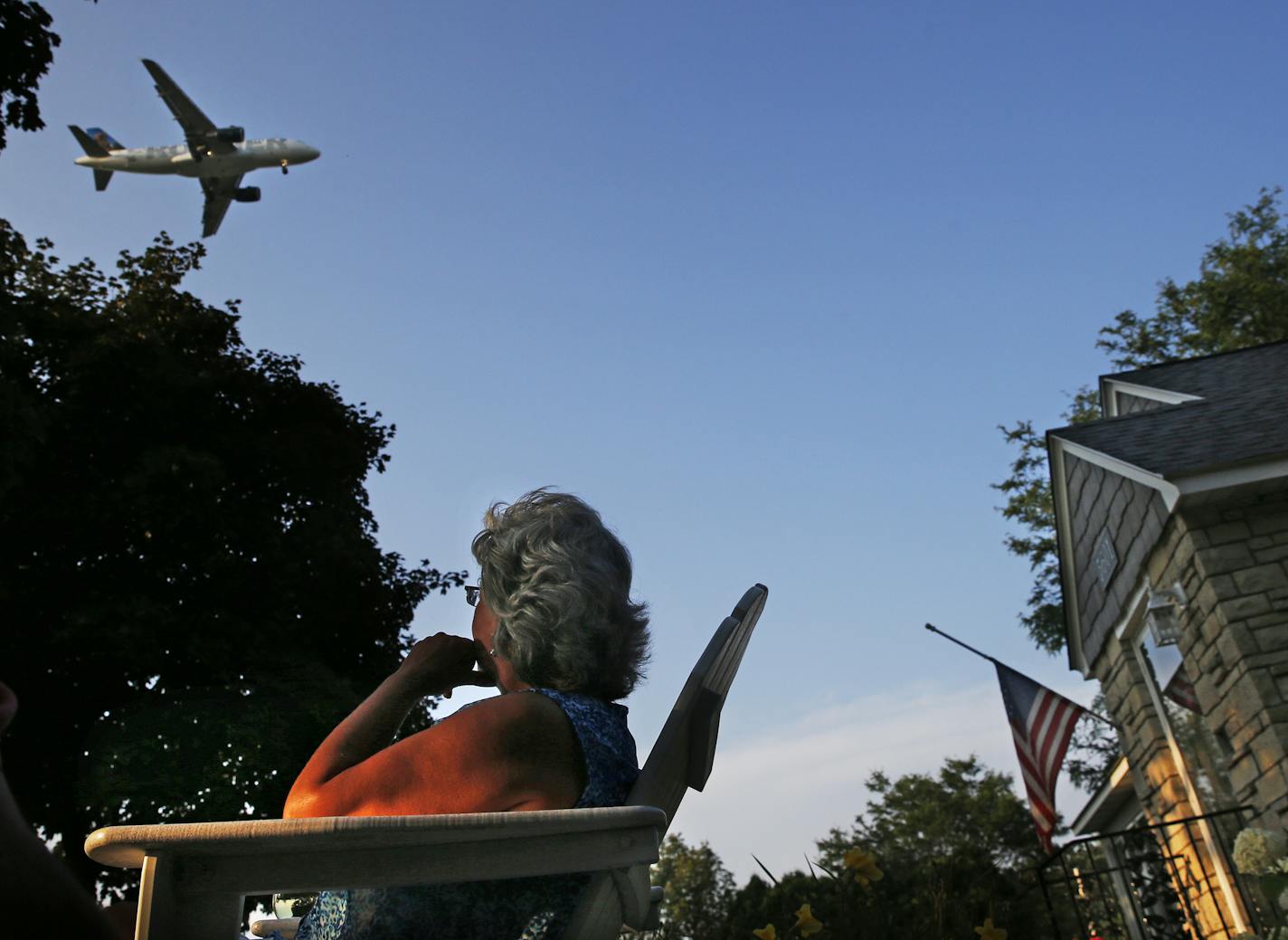 Lori Moen, who has lived in her south Minneapolis home for 23 years, watched a plane approach the airport. Moen and husband, Al, are downsizing and selling the house. One contributing factor to the upcoming move is the frequent airplane traffic.