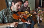 Bluegrass quintet Pert Near Sandstone practiced at Fulton Brewery in Minneapolis. Nate Sipe, J Lenz and Andy Lambert, l-r. (MARLIN LEVISON/STARTRIBUNE