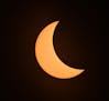The moon partially covers the sun as it moves into a total eclipse, Monday, August. 21, 2017, in Cerulean, Ky. (AP Photo/Timothy D. Easley)