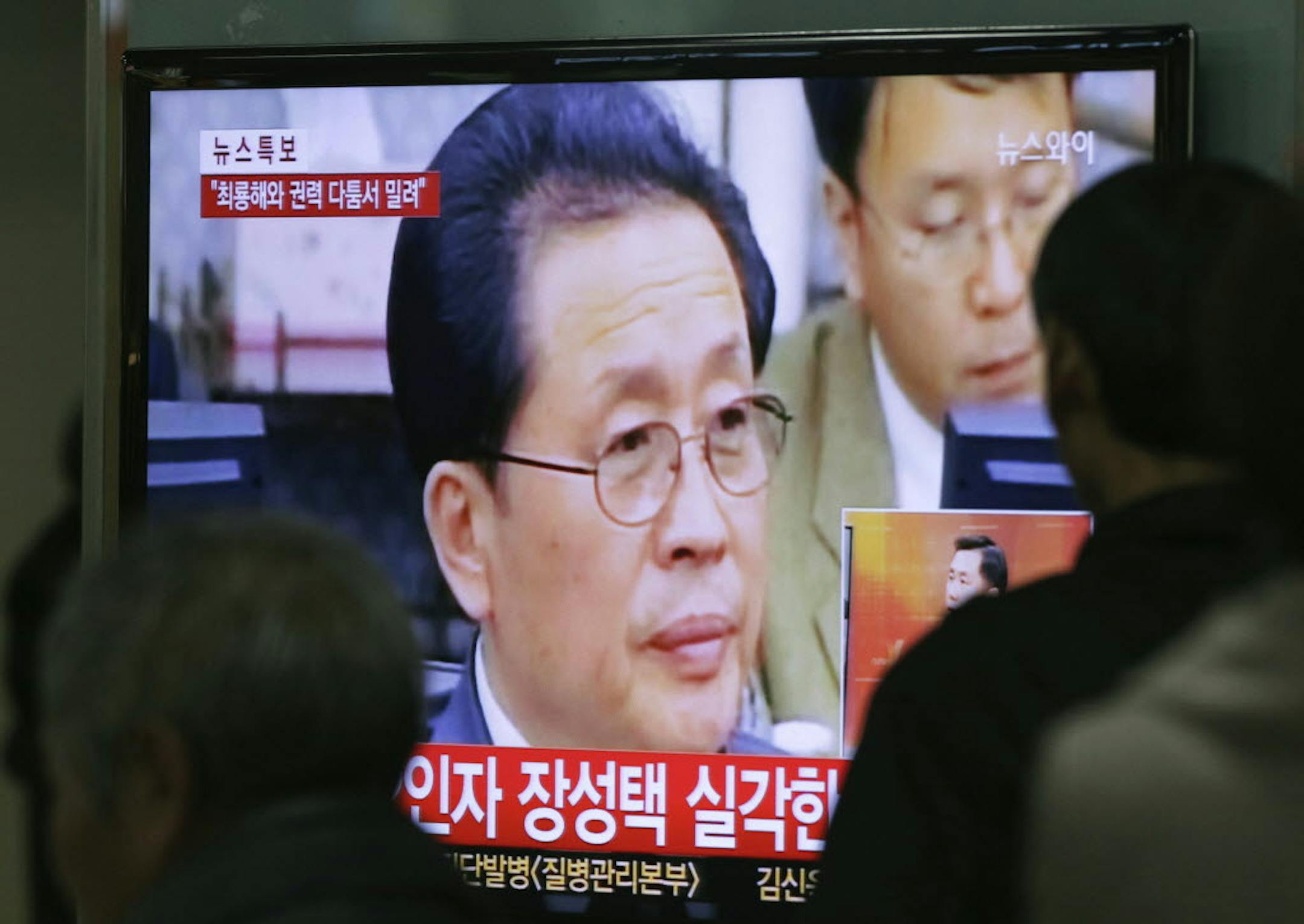 Dec. 3, 2013: People watch a TV news program showing North Korean leader Kim Jong Un's uncle, Jang Song Thaek, , at the Seoul Railway Station in Seoul, South Korea.