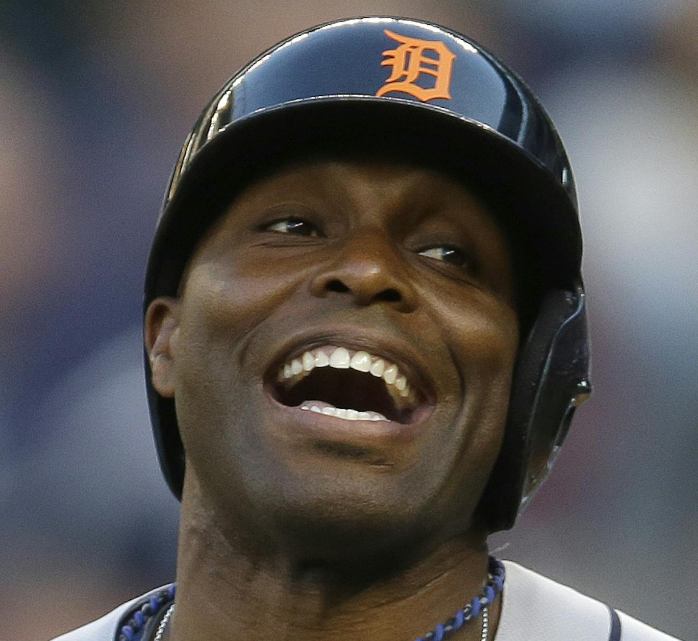 Detroit Tigers' Torii Hunter laughs after he narrowly avoided being hit by a pitch in the first inning of a baseball game against the Seattle Marinesr, Saturday, May 31, 2014, in Seattle. (AP Photo/Ted S. Warren)