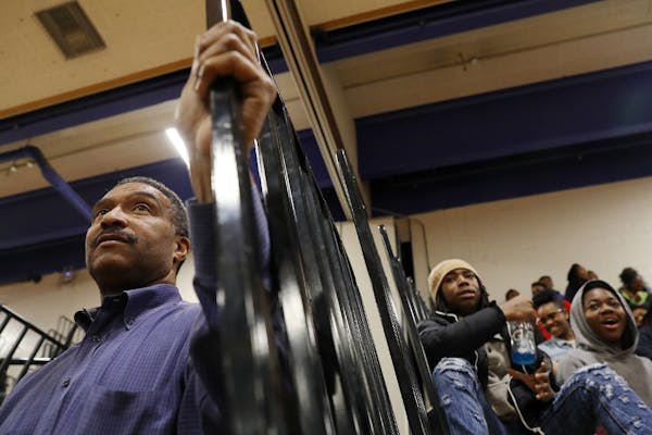 Minneapolis North athletic director Leo Lewis watched from the sidelines during a boys' junior varsity basketball game on Jan. 6, 2017.
