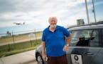 Uber driver Paul Linnee is fighting with the Metropolitan Airports Commission over his right to use a placard on the side of his car that says "UBER-P