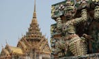 At Wat Arun, the Temple of the Dawn, in Bangkok, Thailand, pieces of porcelain adorn the temples and the mythological creatures lining the facade. (Su