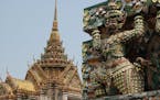 At Wat Arun, the Temple of the Dawn, in Bangkok, Thailand, pieces of porcelain adorn the temples and the mythological creatures lining the facade. (Su