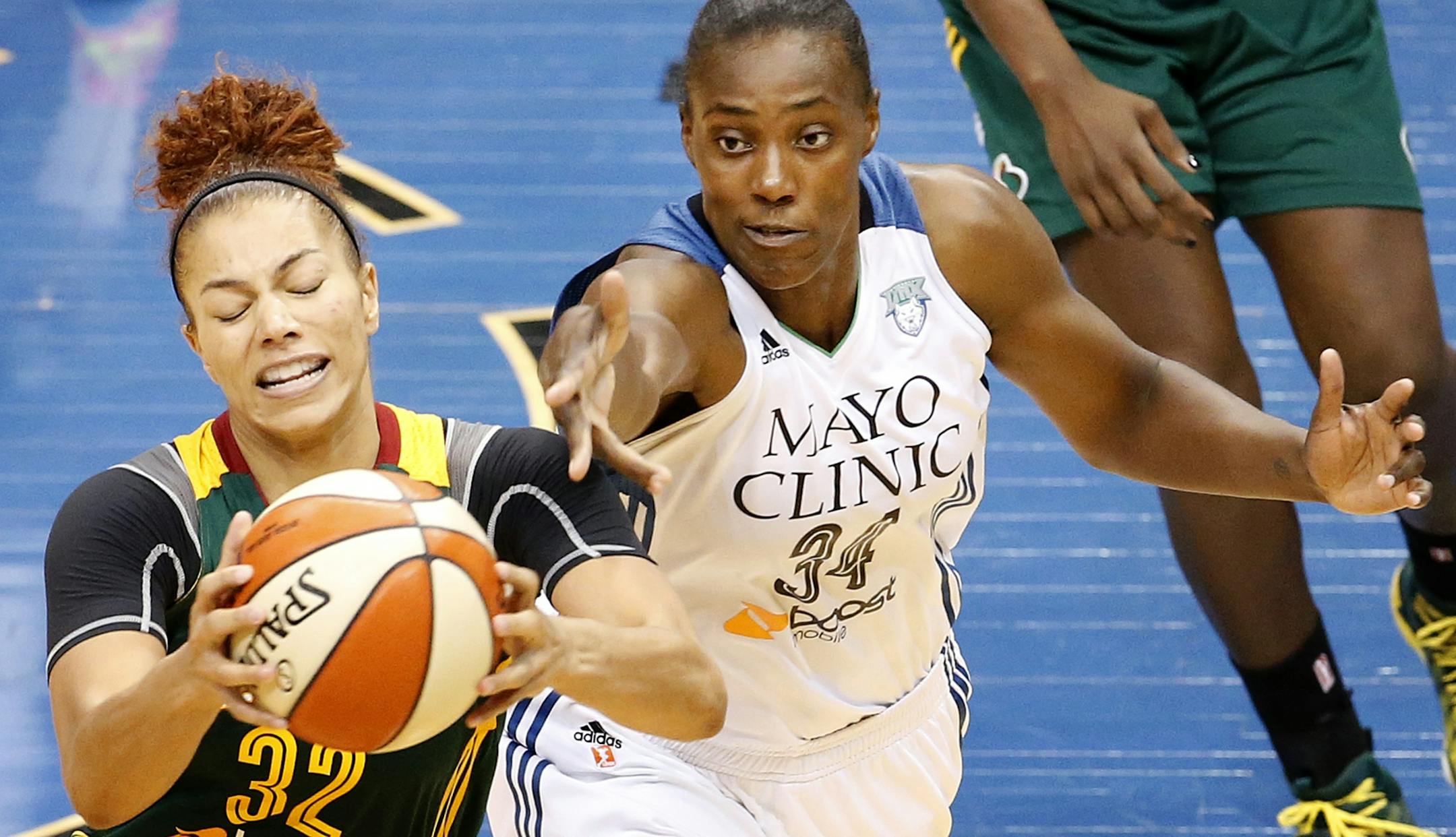 Alysha Clark (32) fought for a rebound with Sylvia Fowles (34) in the fourth quarter. Minnesota beat Seattle by a final score of 73-67.