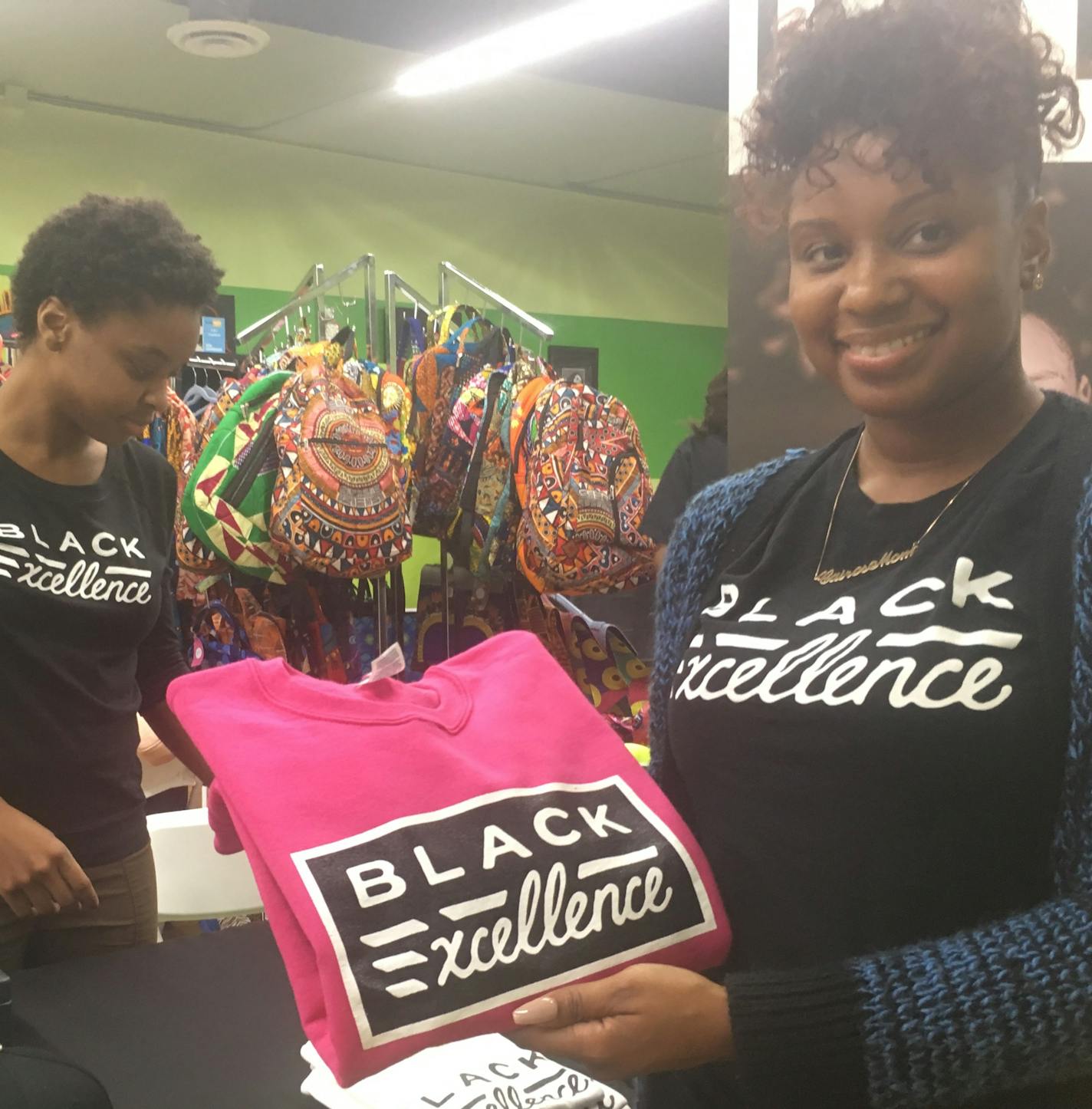 Eshay Brantley (left) and Nakara White (right) staffed the HWMR booth of North Minneapolis clothing designer/retailer Houston White at the NEON Pop-Up Shop on W. Broadway Avenue over Thanksgiving weekend. Photo: Neal.St.Anthony@startribune.com