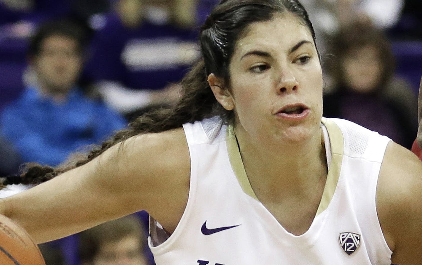 FILE - In this Jan. 17, 2016, file photo, Washington guard Kelsey Plum, left, drives around Southern California forward Temi Fagbenle, second from left, in the first half of an NCAA college basketball game, in Seattle. Plum is expected to be the first pick in the WNBA Draft on Thursday, April 13, 2017. (AP Photo/Ted S. Warren, File)