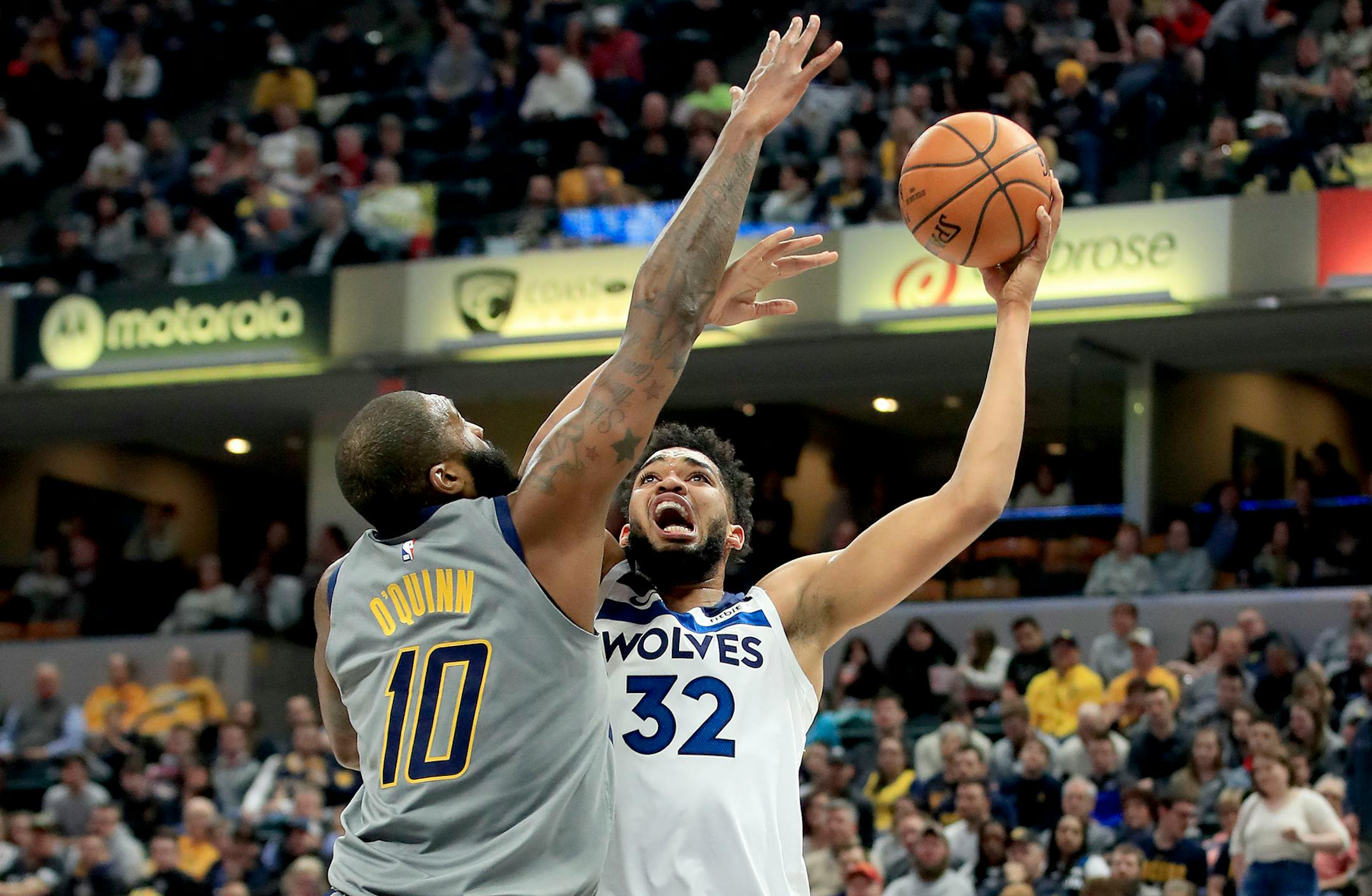 Karl-Anthony Towns shoots against the Pacers' Kyle O'Quinn