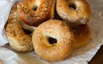 Variety of Authentic New York style bagels with seeds in a paper bag ORG XMIT: 1248759