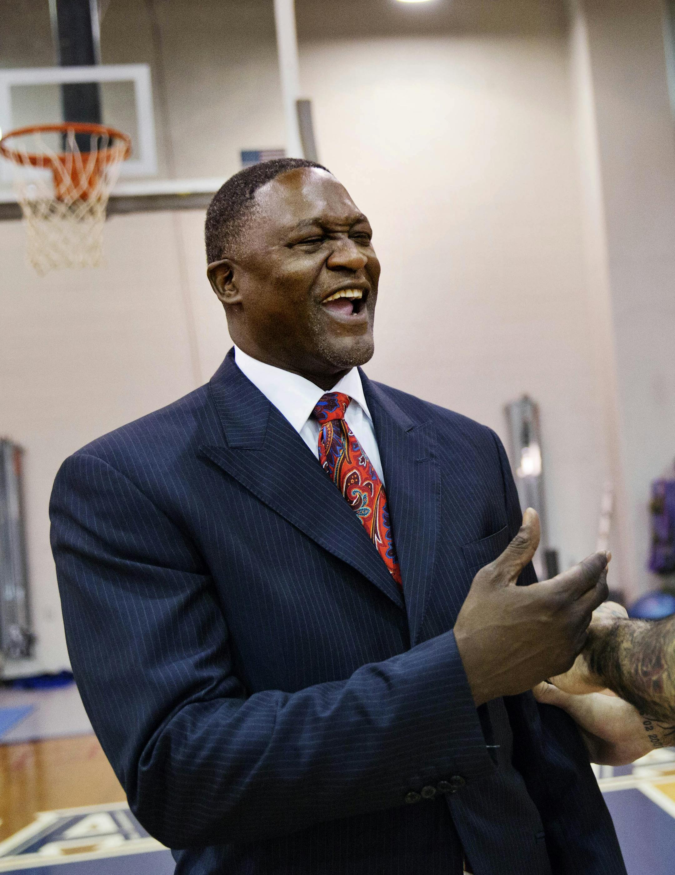 Atlanta Hawks' Pero Antic, of Macedonia, right, jokes with Dominique Wilkins, vice president of basketball operations during an NBA basketball media day, Monday, Sept. 29, 2014, in Atlanta. (AP Photo/David Goldman)