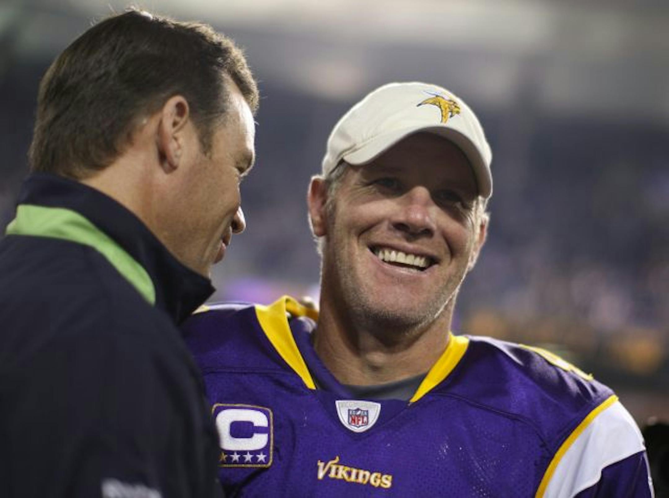 Vikings quarterback Brett Favre laughed after greeting a Seattle Seahawks coach after the game.