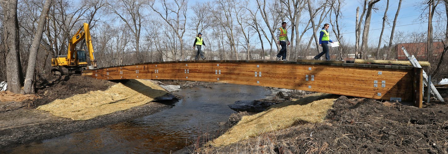 St. Louis Park and Minnehaha Creek Watershed District are installing a walk bridge, paths, and a boardwalk along a stretch of the creek that until now hasn't been accessible to anyone other than canoeists and kayakers. The construction is taking place near the Izaak Walton Creekside Park in St. Louis Park.] Bruce Bisping/Star Tribune bbisping@startribune.com