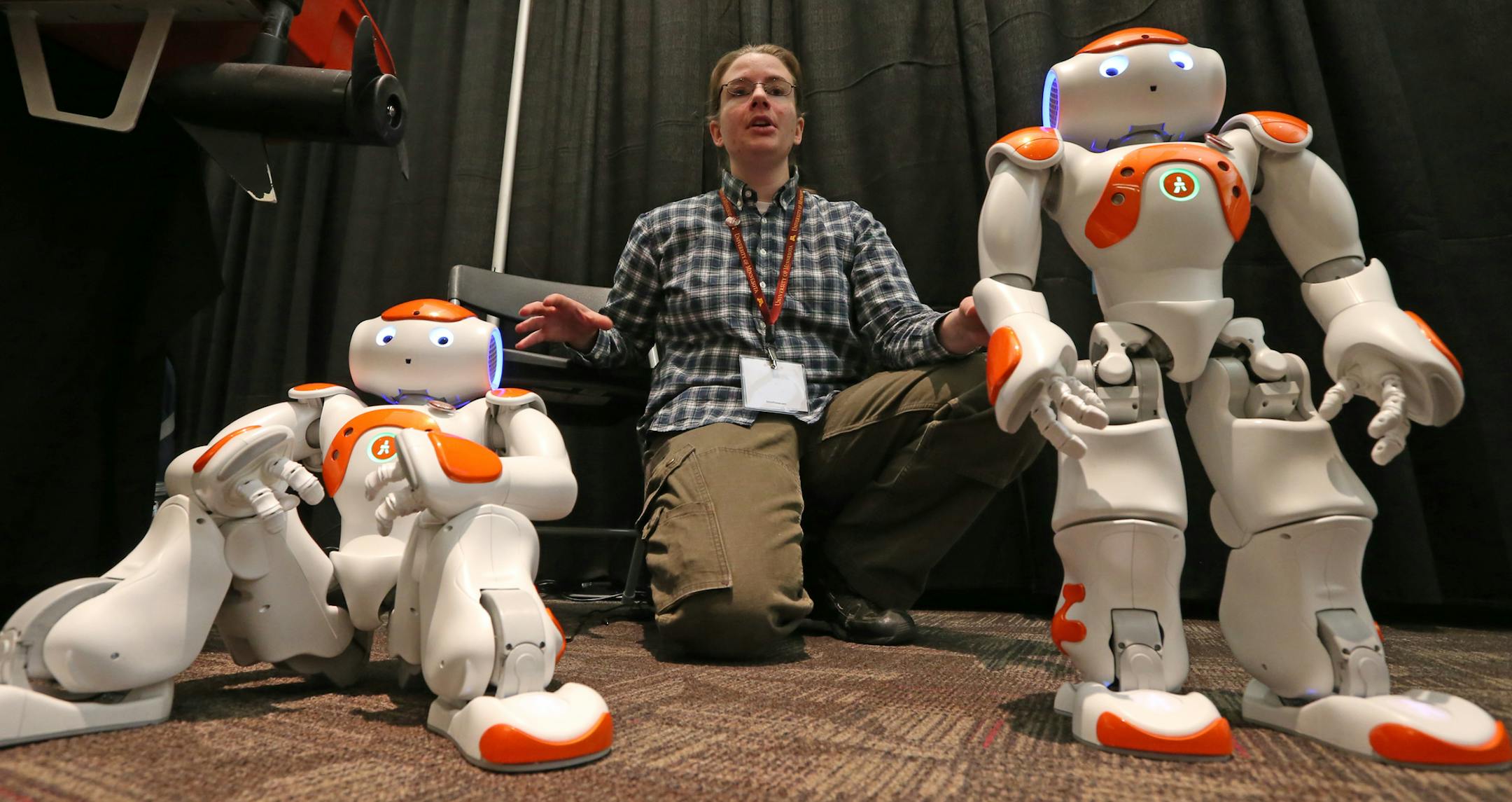 Elizabeth Jensen of the University of Minnesota Department of Computer Science and Engineering demonstrated several NAO robots that are used in programming classes at the U, during the Robotics Alley Conference and Expo at the St. Paul River Center on 11/13/13.] Bruce Bisping/Star Tribune bbisping@startribune.com Elizabeth Jensen/source.