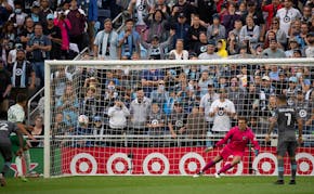 Minnesota United goalkeeper Tyler Miller moves to his left as Colorado Rapids midfielder Cole Bassett's second-half penalty shot tied the match.
