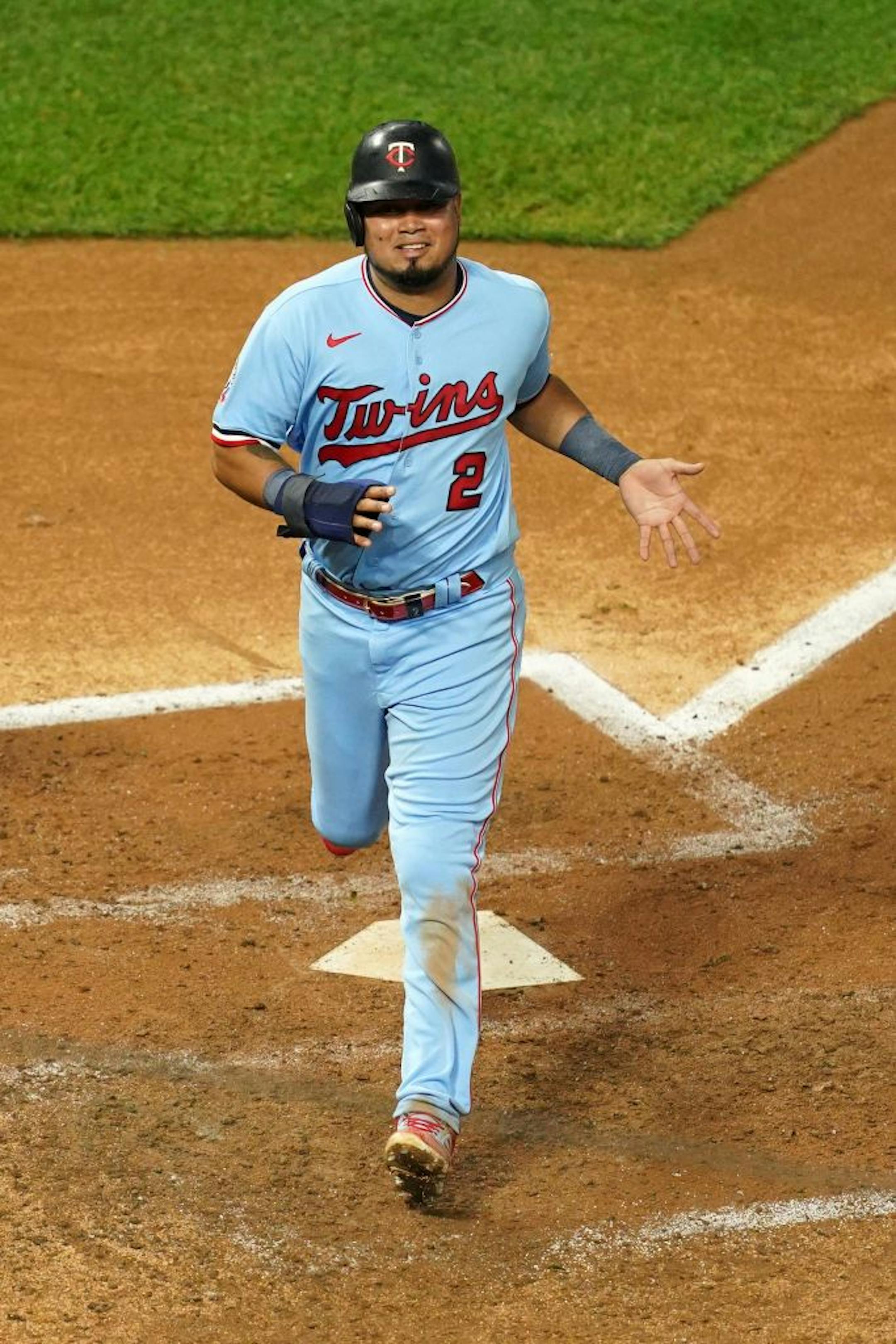 Minnesota Twins second baseman Luis Arráez (2) scored on an RBI double hit by Minnesota Twins left fielder Eddie Rosario (20) in the third inning.