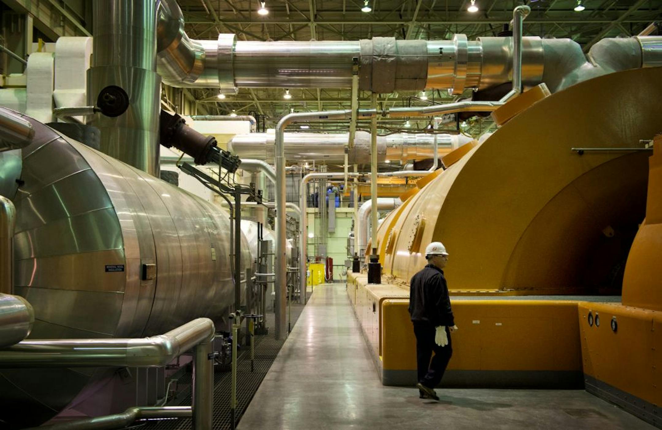 Terry Pickens, director of nuclear regulatory policy for Xcel Energy walked by one of two steam powered generators at the plant. Steam is heated in the nuclear vessel. The Xcel Energy Prairie Island Nuclear Plant north of Red Wing is looking to boost electrical output at the plant.