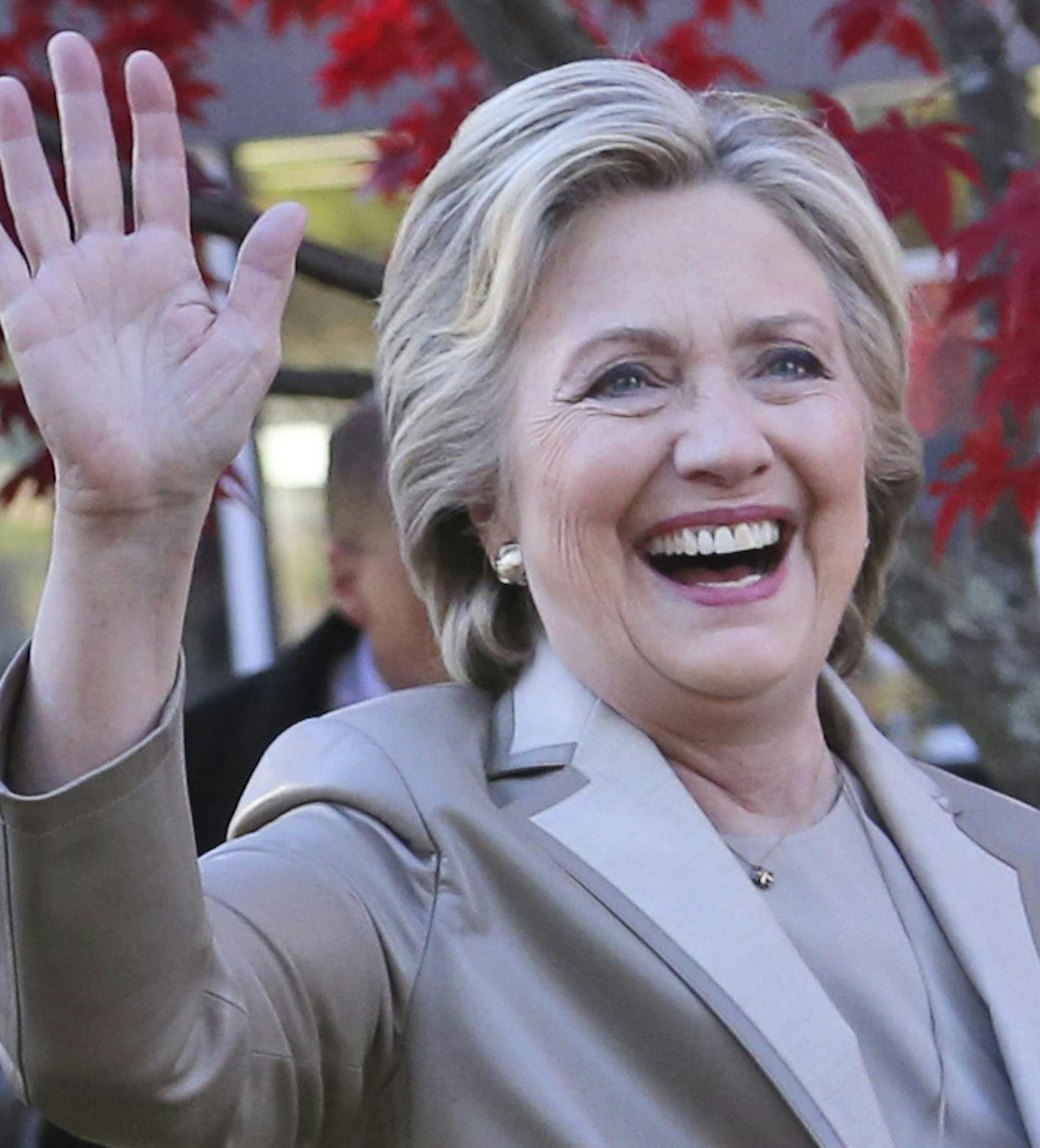 FILE - In this Nov. 8, 2016, file photo, then-Democratic presidential candidate Hillary Clinton, and her husband former President Bill Clinton, greet supporters after voting in Chappaqua, N.Y. The FBI is investigating allegations of corruption connected to the Clinton Foundation while Hillary Clinton was secretary of state. That’s according to a person familiar with the investigation who spoke on condition of anonymity to discuss it. (AP Photo/Seth Wenig, File)