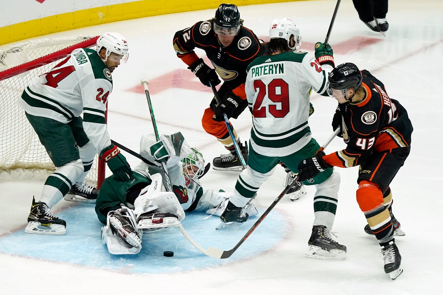 Minnesota Wild goaltender Cam Talbot, bottom left, stops a shot by the Anaheim Ducks during the second period of an NHL hockey game Monday, Jan. 18, 2021, in Anaheim, Calif. (AP Photo/Marcio Jose Sanchez)